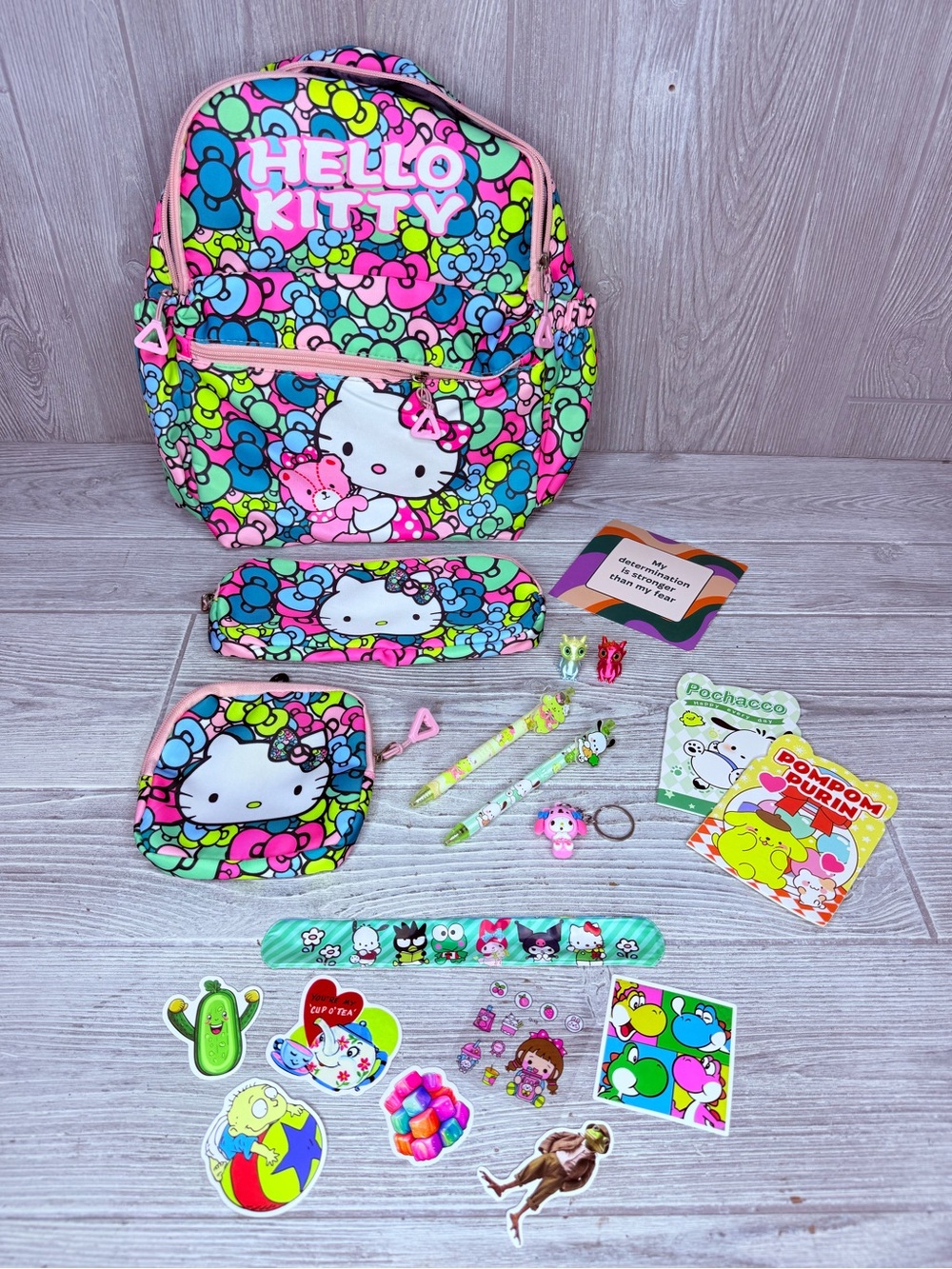 Hello kitty bow backpack bundle change purse stickers keychain dragon pens paper